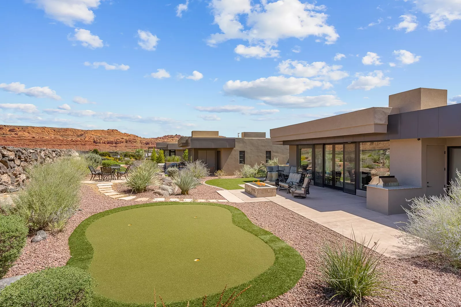 Backyard with Putting Green, Dining Tables, Grill, & Firepit