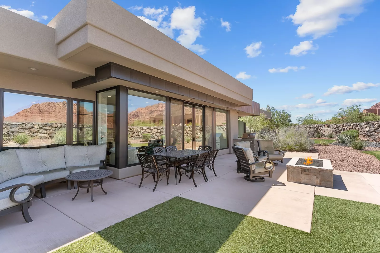 Backyard with Putting Green, Dining Tables, Grill, & Firepit