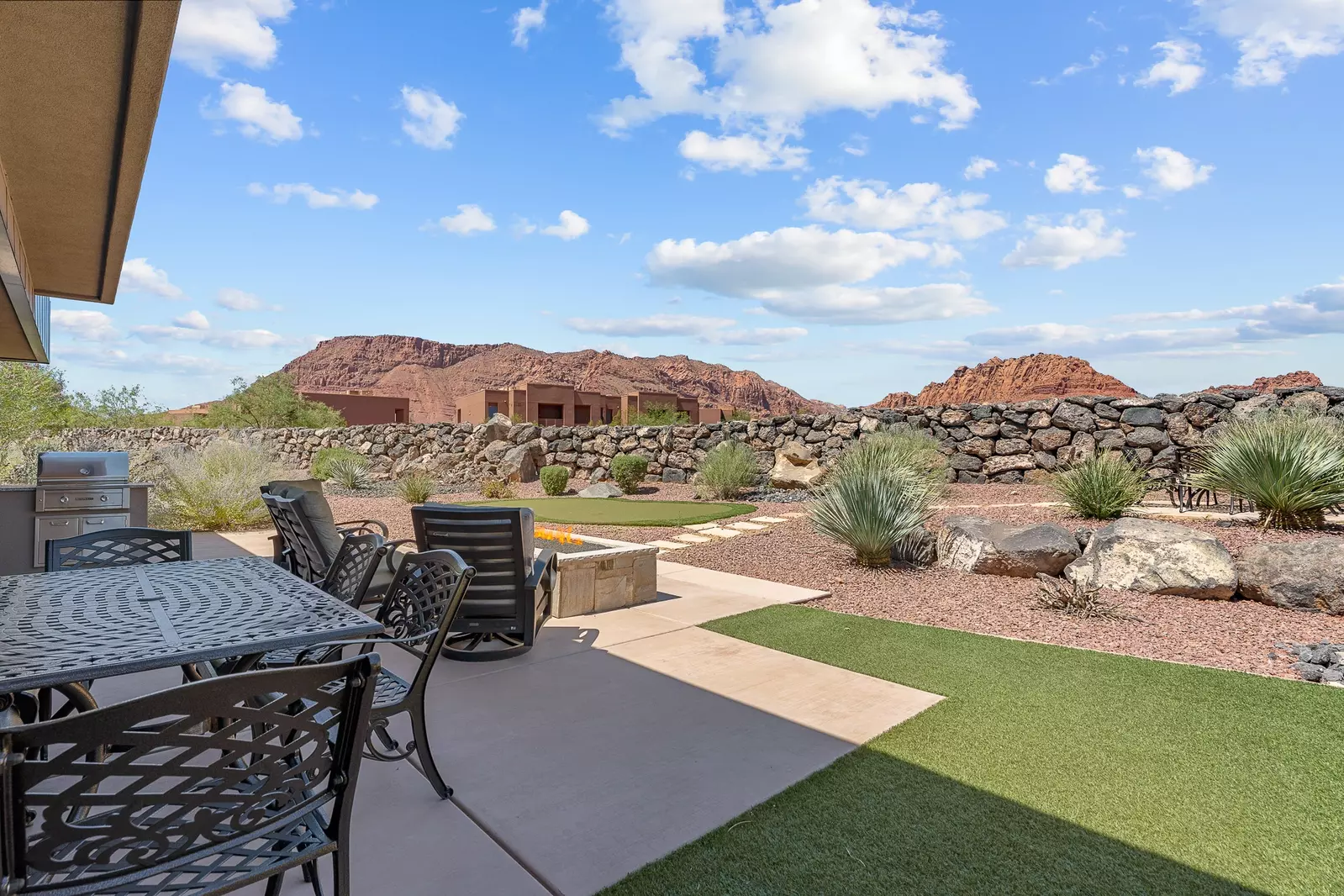 Backyard with Putting Green, Dining Tables, Grill, & Firepit