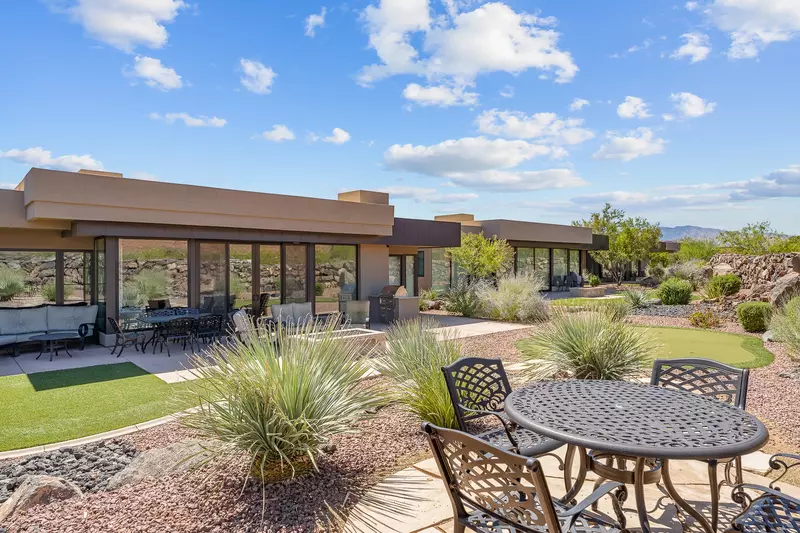 Backyard with Putting Green, Dining Tables, Grill, & Firepit