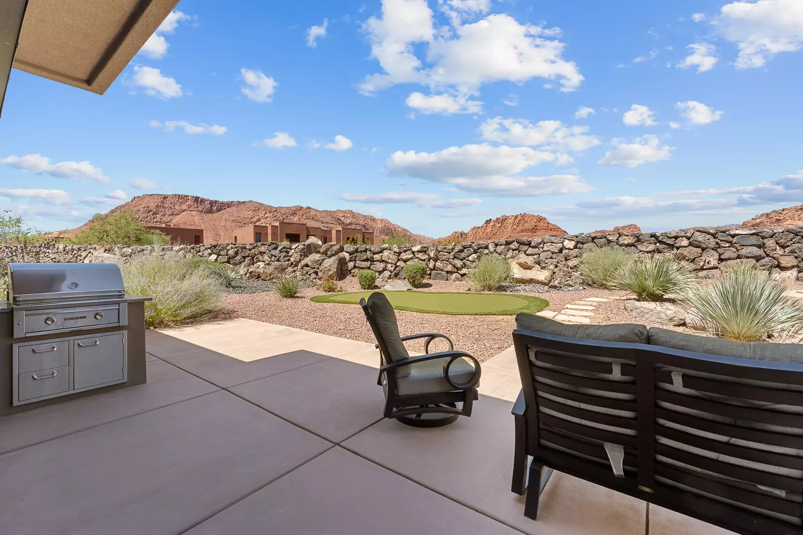 Backyard with Putting Green, Dining Tables, Grill, & Firepit