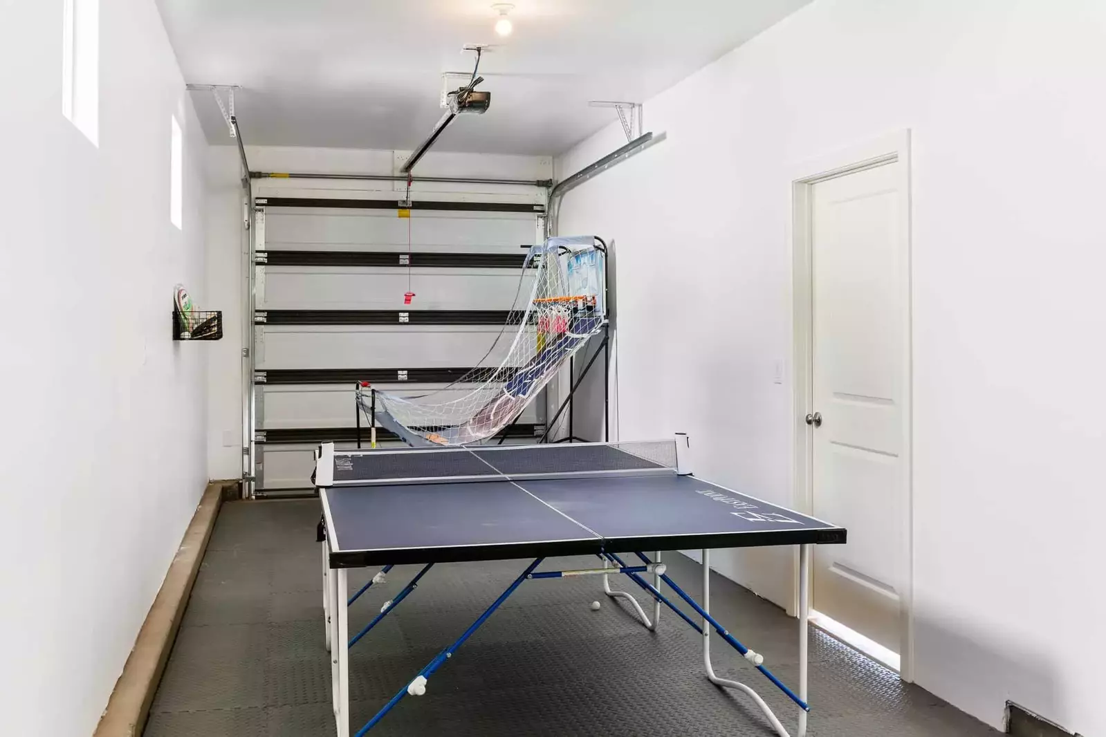 Ping Pong Table and Basketball Game in Garage