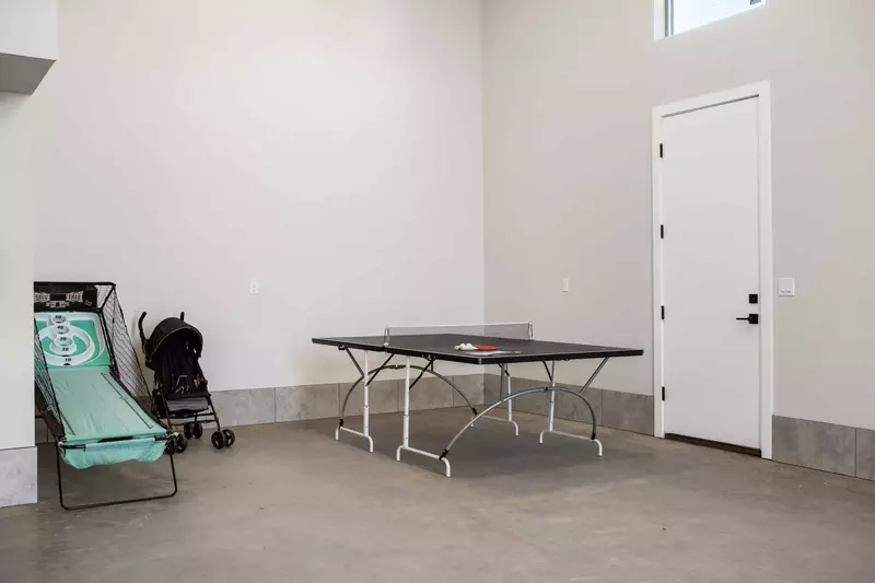 Ping Pong Table and Stroller in Garage